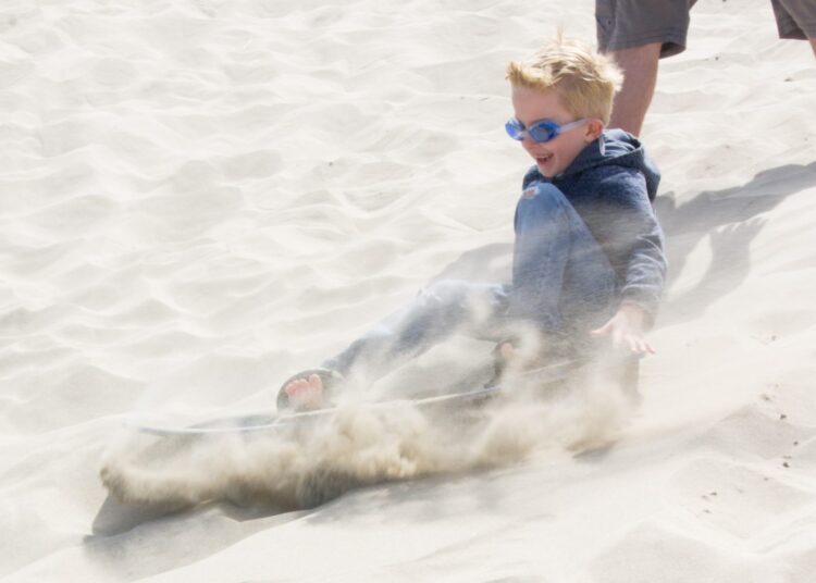Sandboarding is a great family activitiy in Florence Oregon
